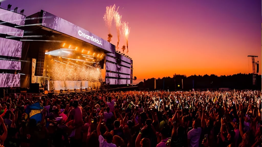 Nighttime fireworks over Creamfields festival grounds