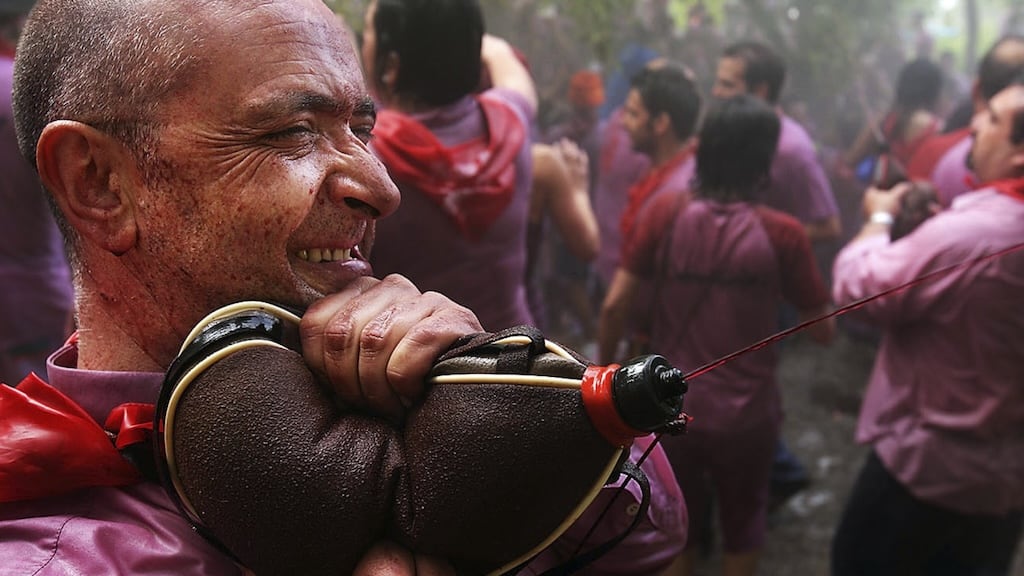 Throwing wine from buckets