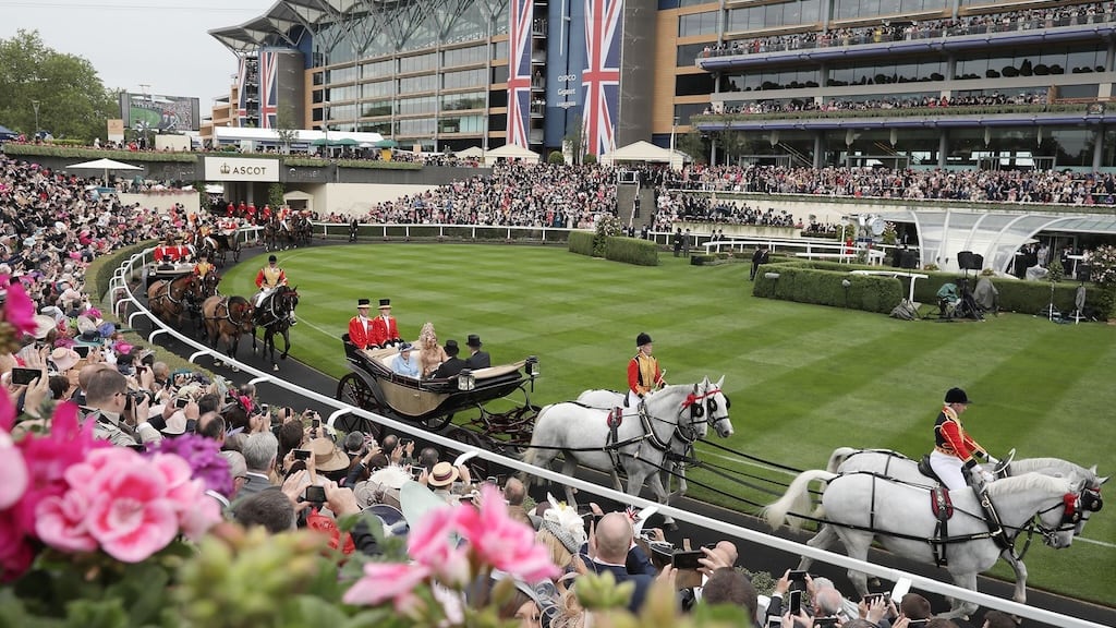 Guests enjoying fine dining and champagne in a Royal Ascot hospitality box